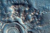 Crater with Thick Ejecta and Mound in Center