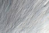 Crater with Rock Exposures and Steep Slopes