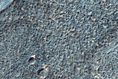 Layered Deposits in Craters in Promethei Terra