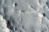 Layers near Crater Rim West of Auqakuh Vallis