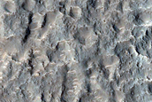 Channel Cutting Crater Rim in Tyrrhena Terra