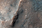 Bright Patches on Crater Floor in Thaumasia Planum