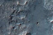 Possible Phyllosilicate-Rich Exposure on Solis Planum Crater Rim