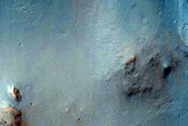 Dark-Toned Material in Terra Tyrrhena Crater Rim