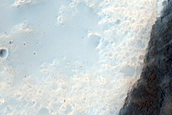 Channel with Fresh Crater in Tyrrhena Terra