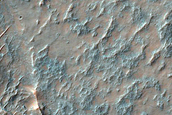 Olivine-Rich Unit Interrupting Wrinkle Ridge in Thaumasia Planum