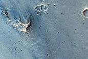 Possible Pyroxene-Rich Outcrops on Ius Chasma Wall and Floor