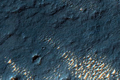 Bright Deposits and Channels in Thaumasia Planum