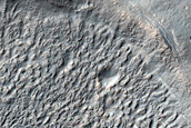 Crater and Brain Terrain near Reull Vallis