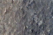 Dark Spots with Bright Streaks Just North of Gale Crater Rim