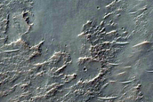 Possible Hydrated Materials on Rim of Crater in Thaumasia Planum