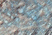 Pyroxene-Rich Materials on Oudemans Crater Floor