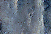 Candidate Recent Impact Site with Bright Material in Sacra Sulci