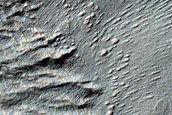 Layers on Crater Floor near Centauri Montes