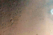 Impact Crater Exposing Bedrock