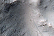 Impact Crater Exposing Bedrock