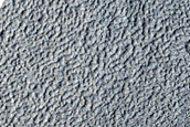 Possible Ice at Base of Fresh Crater in Concentric Crater Fill