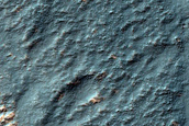 Channels and Bright Blocks near Voeykov Crater