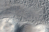 Pitted Cones Intersected by Lobate Contact