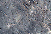 Impact-Related Deposits and Flows near Esira Crater