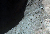 Well-Preserved 1-Kilometer Impact Crater in Ladon Valles