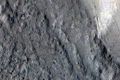 Partial Icy Fill of Impact Crater onto Graben