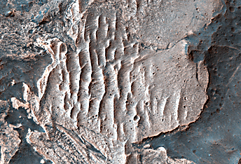 Light-Toned Materials along the Floor and Walls of Ius Chasma