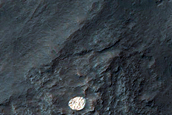Bright and Round Deposit in Eos Chasma