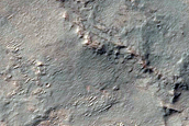 Olivine-Rich Materials on Eastern Scarp of Thaumasia Planum