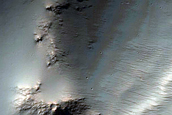 Impact Related Deposits and Flows Northeast of Hellas Planitia