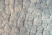 Layers around Crater in Far Western Utopia Planitia