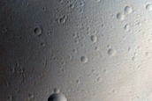 Material Beyond Margins of Ridged Lobe Northwest of Olympus Mons