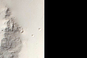 Scour Pits in Crater in Medusae Fossae Formation