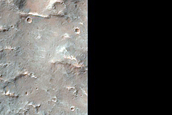 Crater and Channel in Low Southern Latitudes
