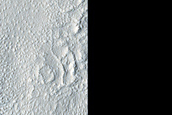 Cones and Irregular Terrain East of Erebus Montes