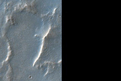 Sinuous Ridges and Layered Deposits on Crater Floor