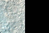 Clay-Rich Materials in Northern Hellas Planitia Crater