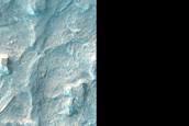 Phyllosilicate-Rich Terrain in Northwestern Hellas Planitia Crater