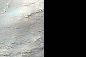 Phyllosilicate-Rich Exposures around Crater Northwest of Hellas Planitia