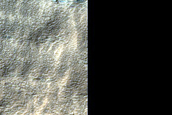 Mid-Latitude Apron and Tongue Materials in Reull Vallis