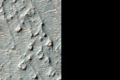 Olivine-Bearing Materials on Kamativi Crater Floor