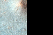 Central Peak and Ring with Megabreccia in 13-Kilometer Diameter Crater