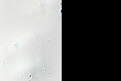 Possible Olivine-Rich Materials around Crater in Terra Sabaea