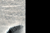 Well-Preserved Crater East of New Impact