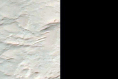 Exposed Portions of Uplift in 30-Kilometer Crater in Terra Sabaea