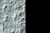 Possible Olivine-Bearing Materials in Eastern Huygens Crater