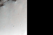 Small Crater in Herschel Crater with Recurring Slope Lineae-Like Features