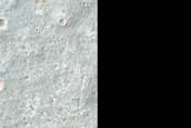 Diverse Minerals near Crater in Terra Tyrrhena