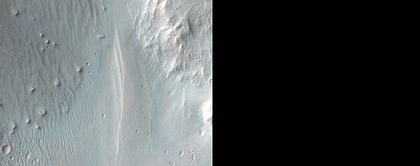 Well-Preserved 6-Km Impact Crater South of Eos Chasma