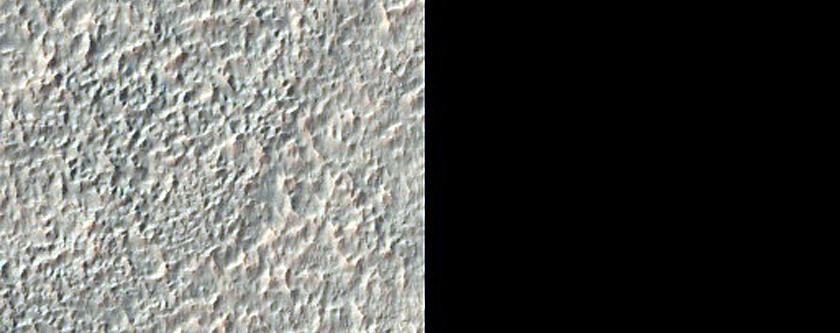 Possible Olivine-Bearing Materials adjacent to Crater in Terra Sirenum